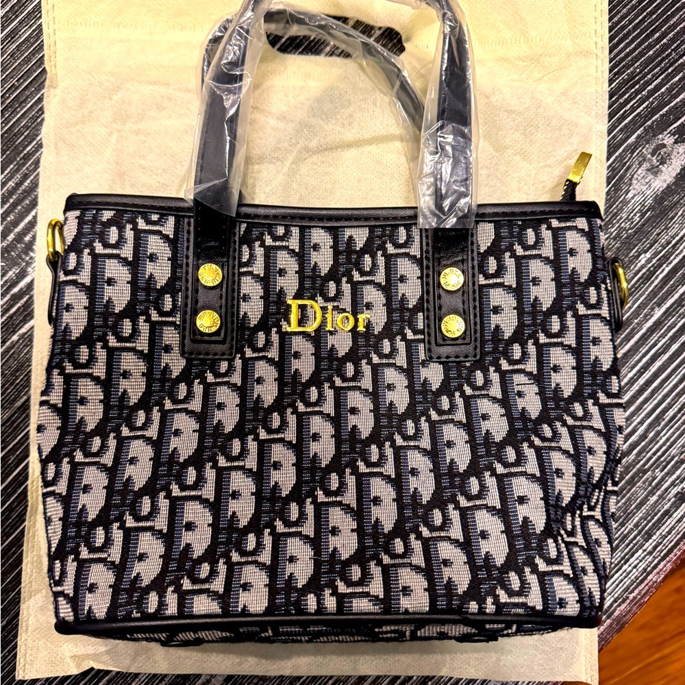 NWOT - Mini Bag with pin strap - gold hardware - black and gray fabric.
